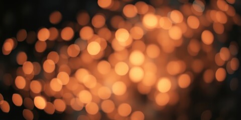 Obraz premium Abstract Background of Warm-toned Bokeh Lights, Ideal for Festive Designs or Holiday-themed Projects