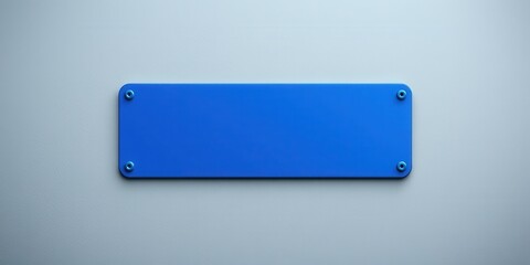 A Vibrant Blue Rectangular Sign Mounted on a Light Gray Wall with Four Visible Fasteners