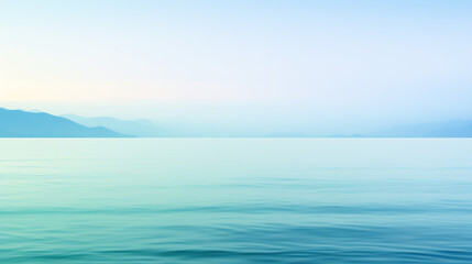 Obraz premium Serene seascape with calm water and distant mountains