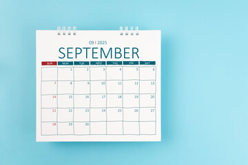 September 2025 Monthly desk calendar for 2025 year on blue color background.