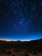 Fototapeta premium Starry night sky over a desert landscape at dusk