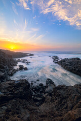 The sea breaking against the rocks