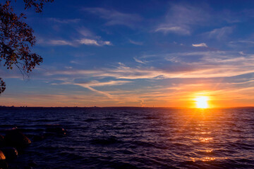 Evening summer sky-water sunset during the white nights season in Karelia.