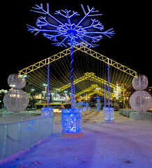 An ice town with illumination on the street on a winter evening.