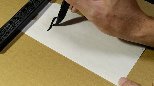 Writing Chinese Calligraphy on paper, Translation: "summer solstice".