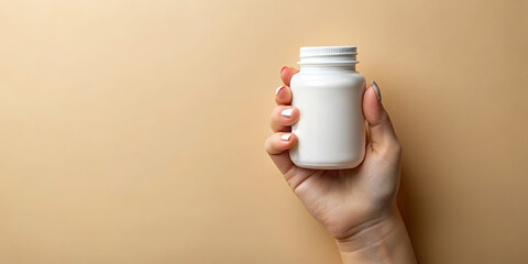 A hand grips a plain white bottle against a soft, neutral background. The simplicity of the scene emphasizes the product's design and invites curiosity about its contents