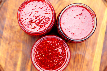 Raspberry jam in canning jars. Berry jam made from fresh home-grown fruits. 