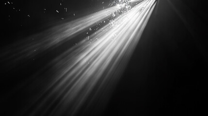 Bright Rays of Light Penetrate Dark Water Creating a Serene Underwater Atmosphere