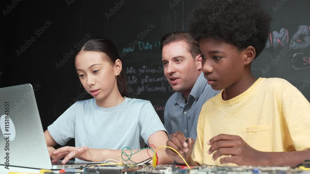 Poster caucasian teacher pointing at laptop while teaching about engineering code. instructor working by us