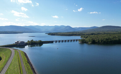 aerial view of the ashokan reservoir in upstate new york (near woodstock olivebridge) nyc drinking water and catskill mountains (catskills hills background) park road walkway bridge crossing lake pond