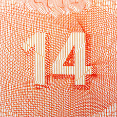 Close-up of intricate orange number 14 design on white background.