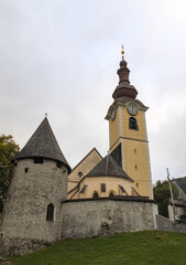 Fototapeta premium view of famous church tower in downtown tarvisio italy (julian alps) beautiful town