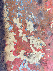 A wall with a lot of paint peeling off