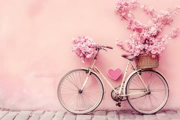 Selbstklebende Fototapeten A vintage bicycle adorned with pink flowers against a pastel wall, exuding a charming vibe. © Bento