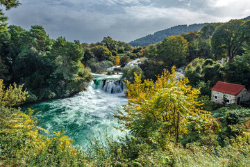 Krka National Park, &Scaron;ibenik-Knin &ndash; HR - Oct 17, 2024 Skradinski buk waterfall, with cascading tiers, lush greenery, and crystal-clear turquoise waters.