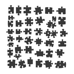 Naklejka premium A Collection Of Black Puzzle Pieces On A White Background