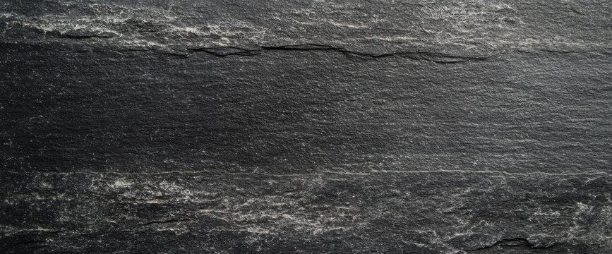 A minimalistic black chalkboard background with a smooth, lightly textured surface, offering a timeless and adaptable design for stock photography or themed visuals