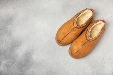 Soft slippers on a bright colored background, close-up. House slippers. Comfortable shoes for home....