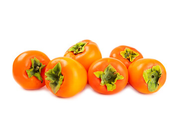 Persimmon isolated on white background. Persimmon fruit. Slice of ripe, juicy, sweet persimmon fruit. Vegan. Fruit garden. Close-up.
