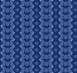 Seamless texture in the form of a pattern of leaves and flowers on a blue background