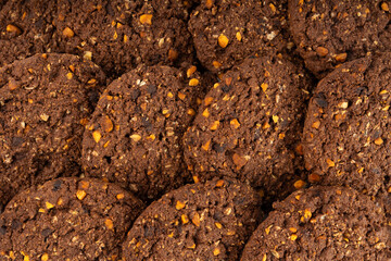Chocolate oatmeal cookies texture background, healthy cereal oat crackers with nuts pattern