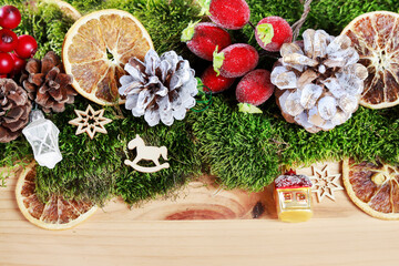 Classic Christmas garland with moss and dried fruits.