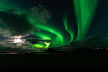 Aurora Borealis
Northern Lights
Night Sky
Winter Landscape
Celestial Phenomenon
Green and Purple Lights
Arctic Scenery
Starry Night
Natural Wonder
Icelandic Aurora