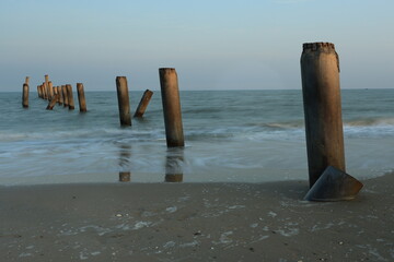 Inclined Column Beach, scenery view of the concrete columns from the old port with beautiful sky on Sao Iang Beach at Phetchaburi province,Thailand