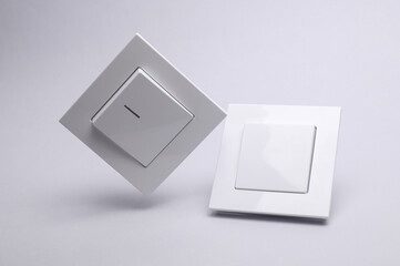 Floating light switches on white background