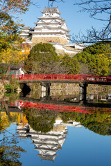 Obraz premium View of the Himeji Castle at sunrise during koyo season, Hyogo, Japan.