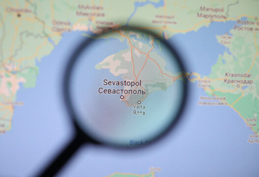 UKRAINE, ODESSA - JUNE 21, 2023: Sevastopol on google maps through magnifying glass