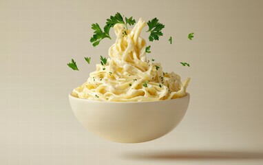 A bowl of creamy fettuccine Alfredo levitating mid-air with parsley garnish, on a soft beige background