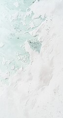 Obraz premium White paint swirling with light green water creates captivating abstract shapes and a stunning artistic texture, showcasing a harmonious blend of colors and fluid movement