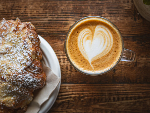 Top View of Heart Latte Art: Coffee and Croissant Pairing