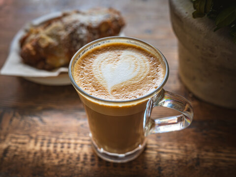 Heart Latte Art: Coffee and Croissant in a Cozy Setting