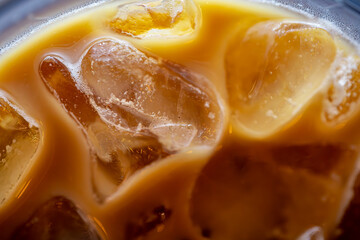 Close-Up of Iced Coffee: Creamy Beverage with Ice Details