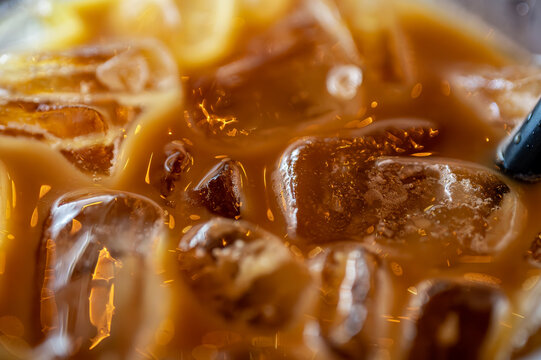 Iced Coffee Close-Up: Refreshing Beverage with Ice Cubes