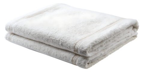 Soft white towels neatly folded on a surface, perfect for enhancing the cleanliness of a bathroom or spa area