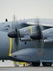 Military turboprop aircraft engine propellers in motion, engine check before flight