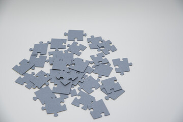 monochromatic puzzles in a pile lying on a white background