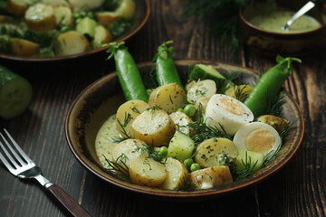 A bowl with farming summer salad in rustic style