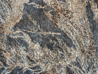 Random design with abstract cloud, brushed, and wavy pattern, in blue, grey, and beige color. Random washed wavy cloud pattern carpet rug seamless background texture