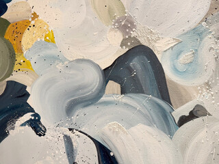 Close up of random brushed paint in blue, white, and yellow color with random cloud and wave pattern. random seamless background texture