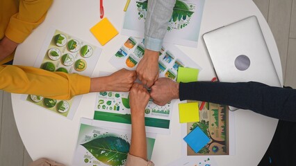Top view creative project team meeting in boardroom at desk, discussing ecological project,...