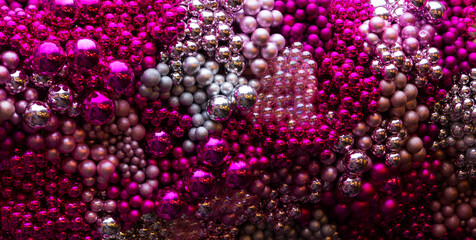 Decorations with pink and crimson shiny balls. Close-up