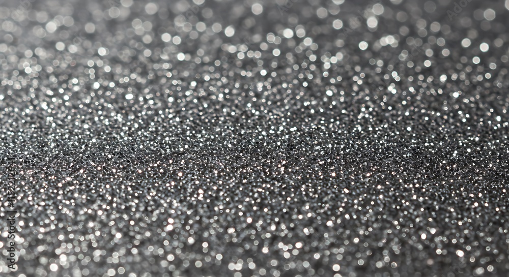 Poster sparkling silver glitter bokeh background. shiny gray texture with light.