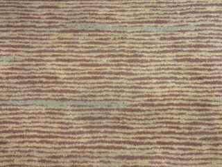 Fototapeta premium Close up of horizontal stripes line carpet rug pattern. Brown and beige horizontal strips and linear line pattern seamless background texture. 