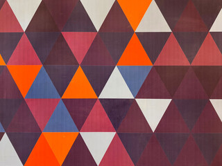 Colorful series of geometric triangular pattern in white, red, orange, maroon, purple, and blue color. Modern geometry triangular illustration multicolor, seamless background texture.