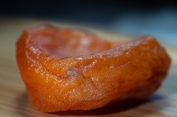 Macrophotography of dried apricot fruit, texture of ready-to-eat fresh juicy dried apricots.
