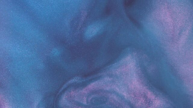 Amazing abstract textured background. Abstract blue pink background with sequins. Mother-of-pearl liquid with a shiny metallic sheen, mechanism, cosmetic gel